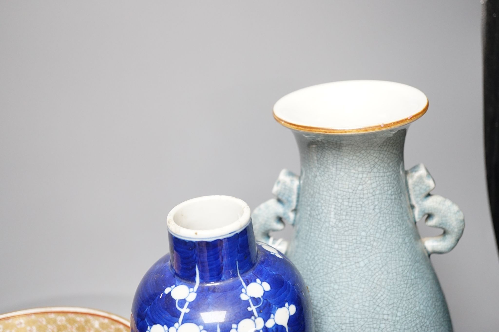 A Chinese blue and white Prunus vase, a Chinese enamelled porcelain bowl and a pale blue crackle glaze vase, tallest 32 cm